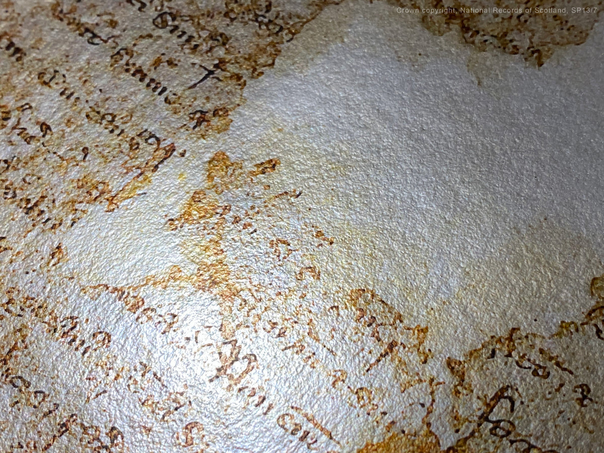 Black Onyx Burnished Gold fine-art photograph showing bright manuscript calligraphy detail.