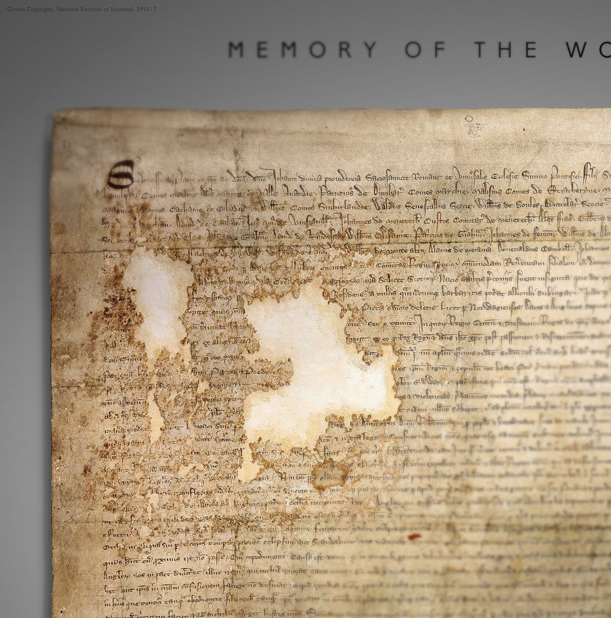 Close detail of the upper manuscript area of the Pewter Burnished Gold Declaration of Arbroath print, showing aged parchment, historic script and the partly visible “Memory of the World” heading.