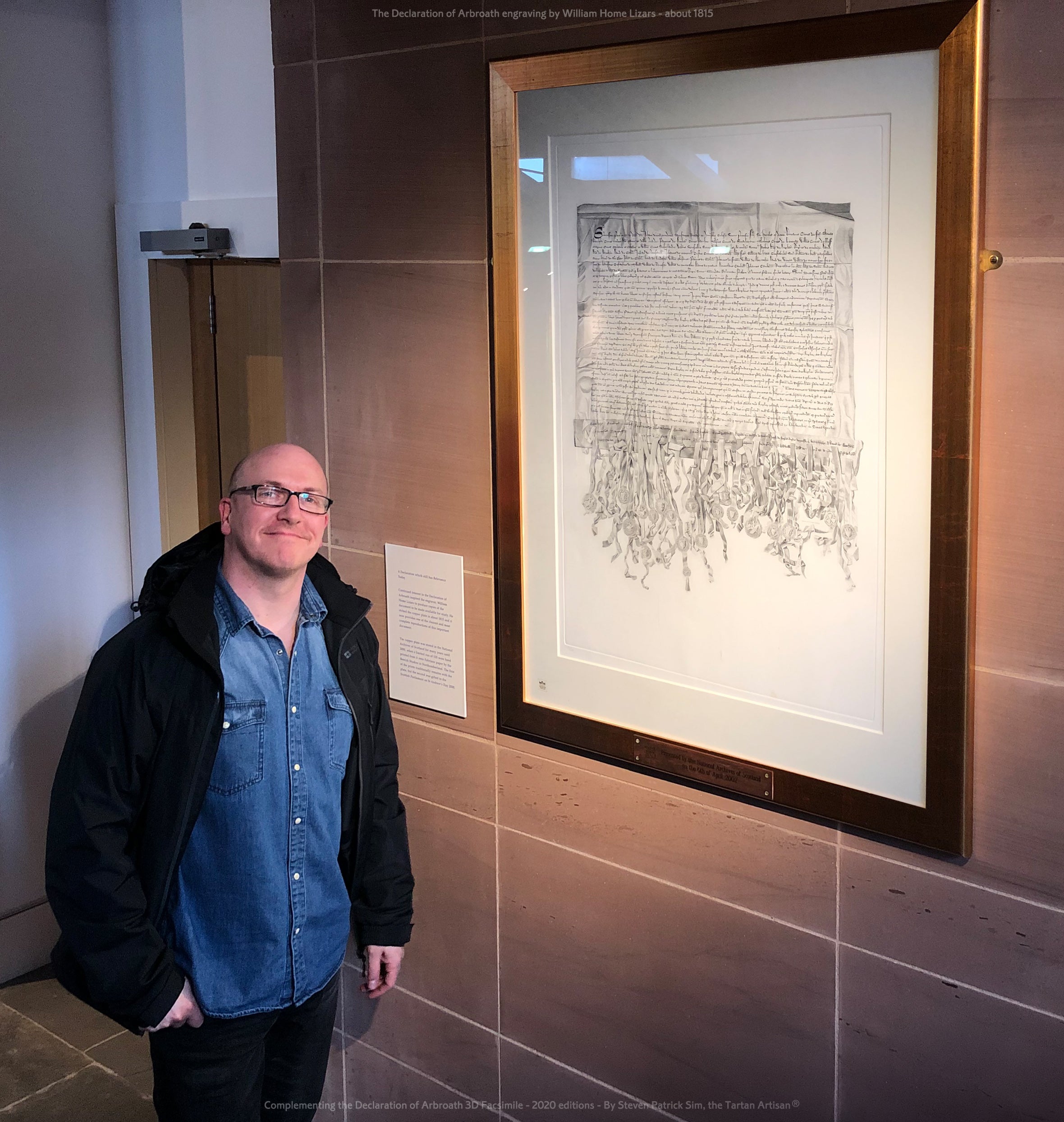 Steven Patrick Sim beside the William Home Lizars engraving of the Declaration of Arbroath, linking the artist to the historical source material.