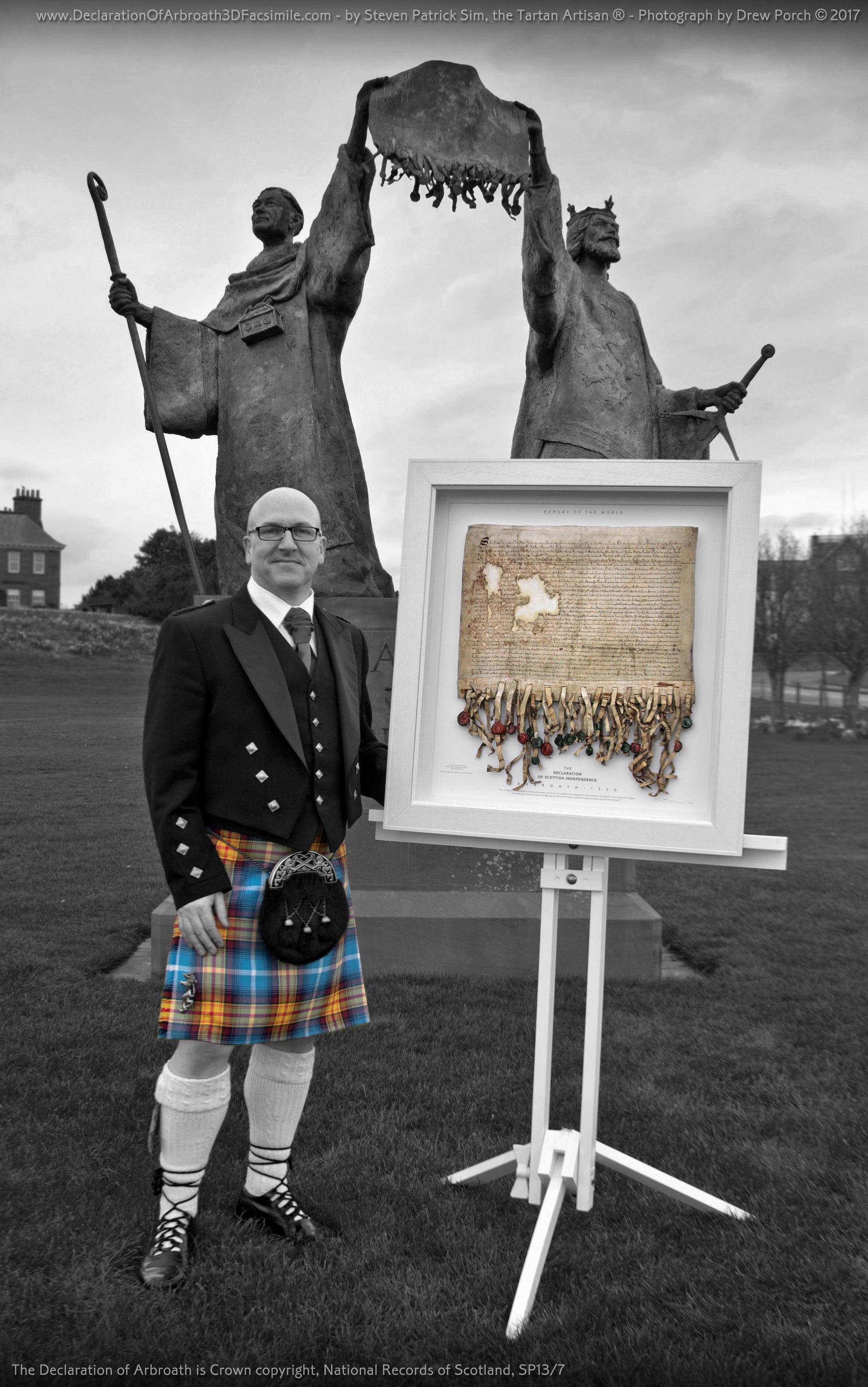 Steven Patrick Sim with the life-size Declaration of Arbroath facsimile at the Robert the Bruce statue in Arbroath.