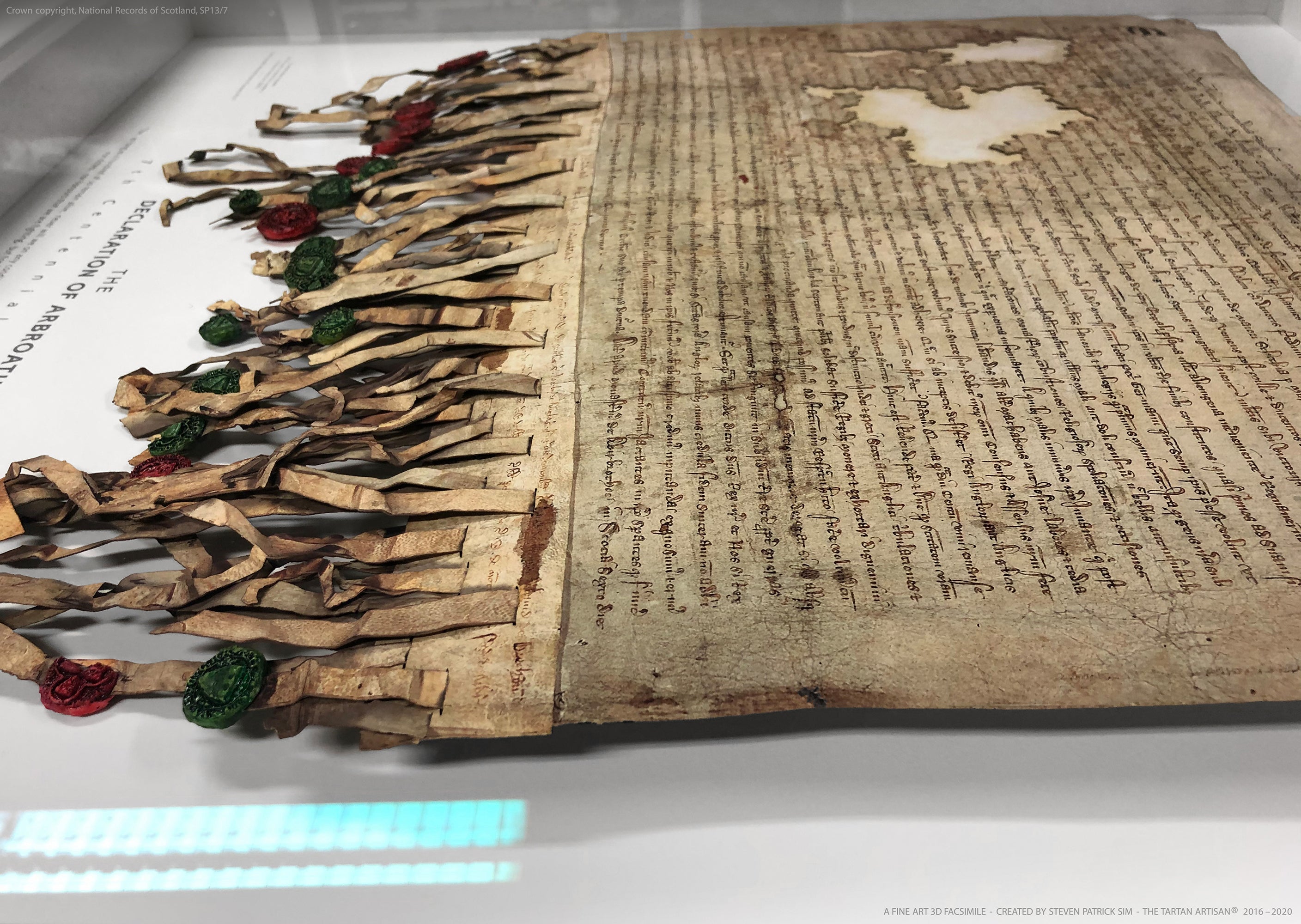 Diagonal presentation image of the Declaration of Arbroath Fine-Art 3D Facsimile, focusing on the parchment surface, torn lower edge, ribbon tabs and three-dimensional cast seals.