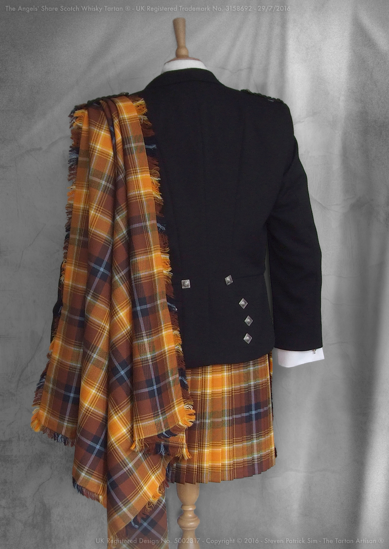 Studio photograph of the Angels’ Share tartan fringed fly plaid - full rear view.