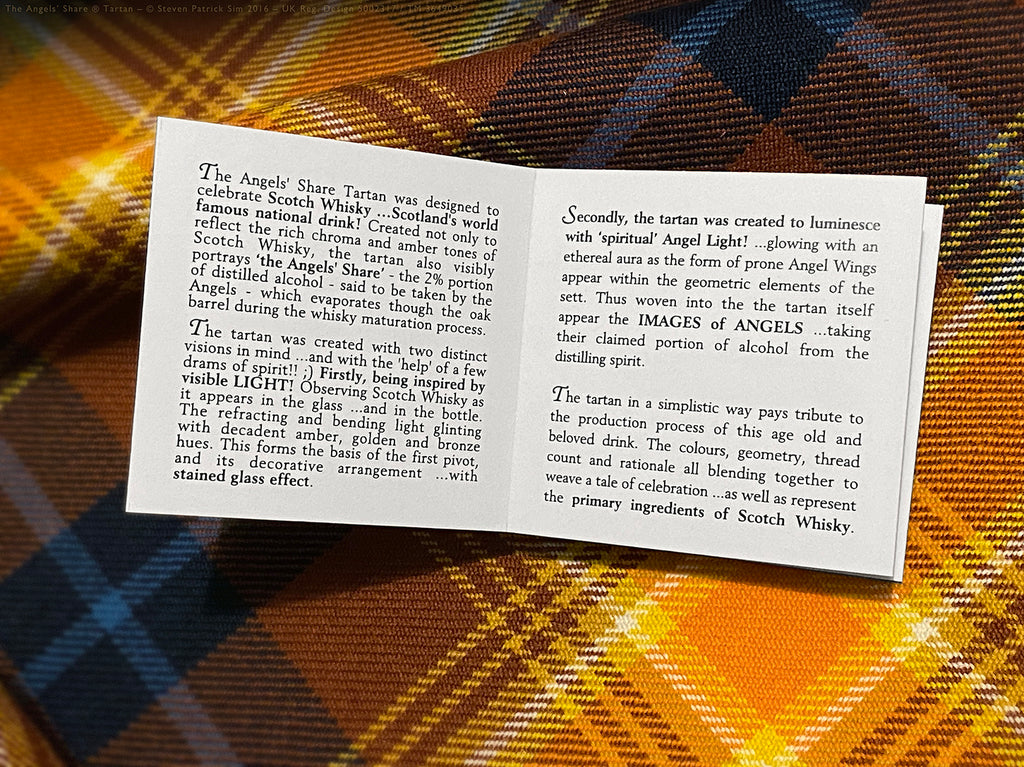 Open Angels’ Share tartan booklet showing the design story text celebrating Scotch whisky, laid across the tartan fabric background.