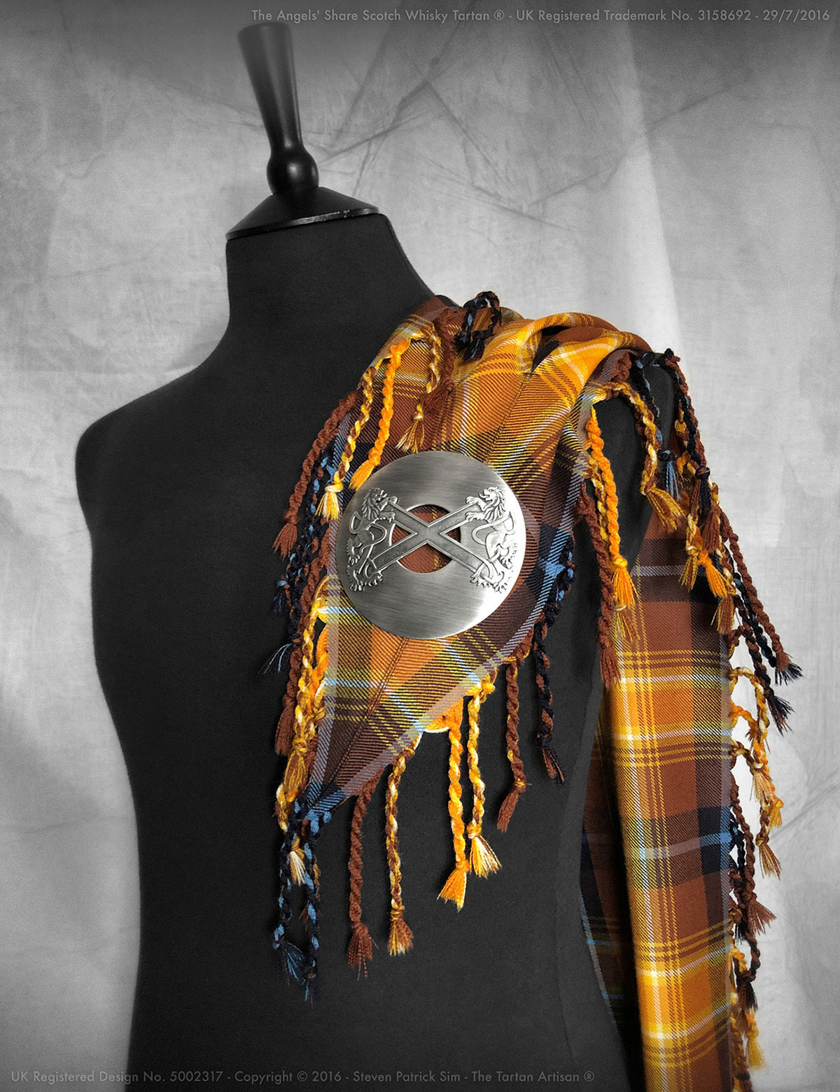 The Angels' Share purled and knotted fly plaid, with example pewter highland brooch.