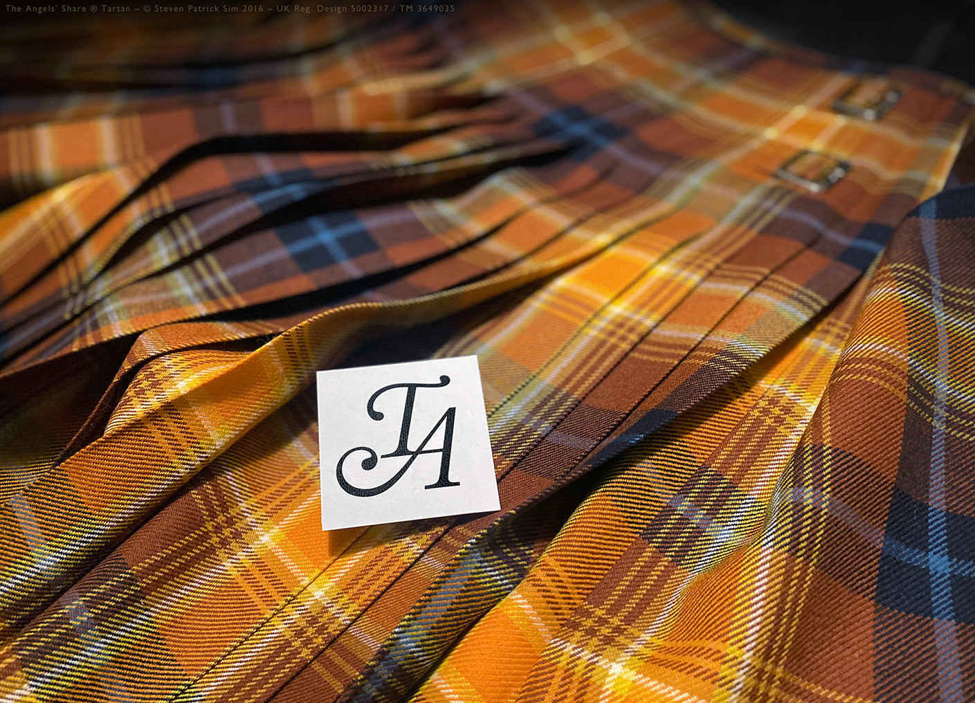 Full-length 8-yard Angels’ Share® kilt laid flat, pleated to the sett in bold symmetry using 16oz heavyweight tartan woven by Lochcarron. The classic pleat-to-sett — rich, bold and anchored in tradition. By the Tartan Artisan (Steven Patrick Sim).