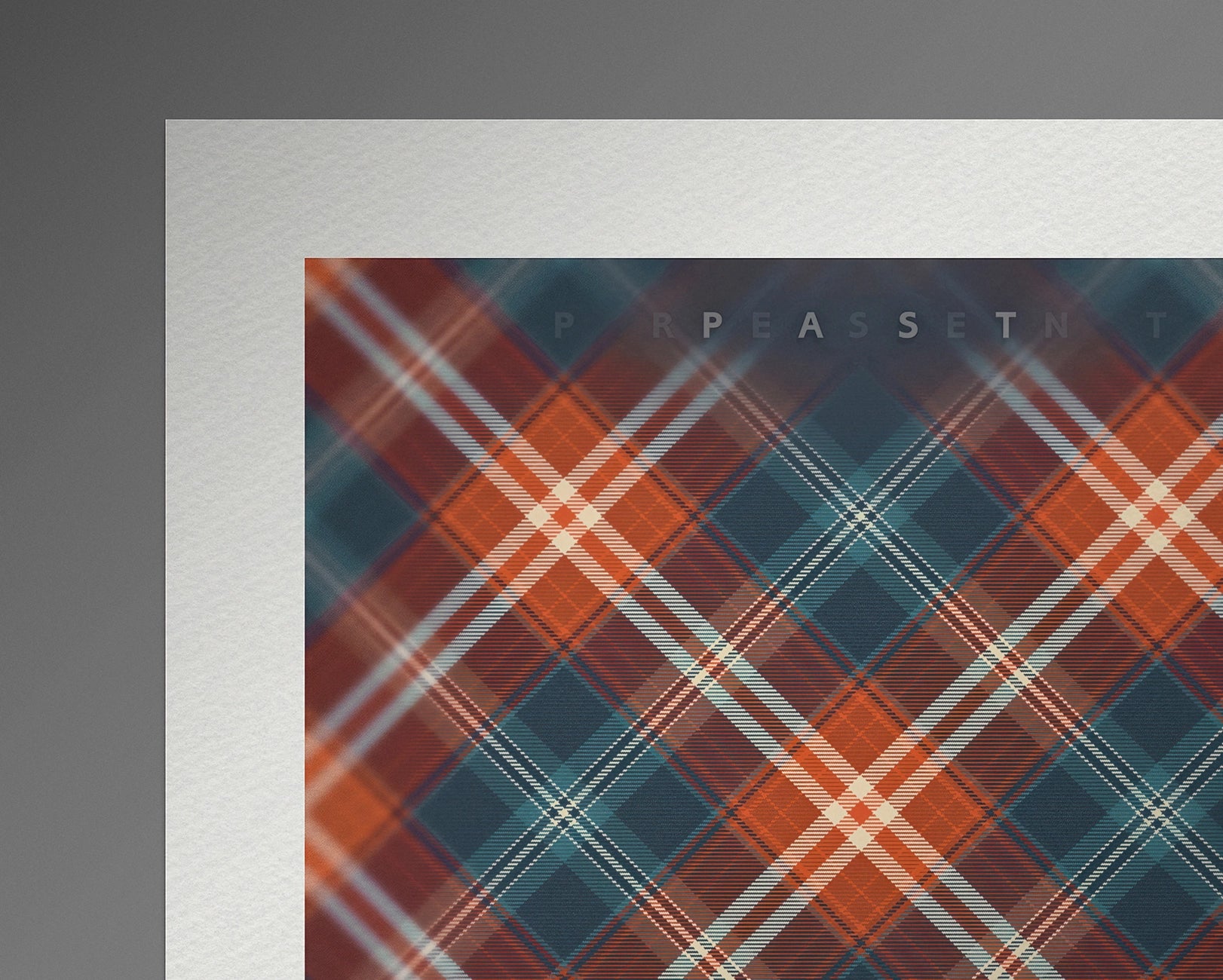Close-up of the top-left section of the print, showing the bold intersecting tartan lines and the word "PAST" subtly marked above the pattern.