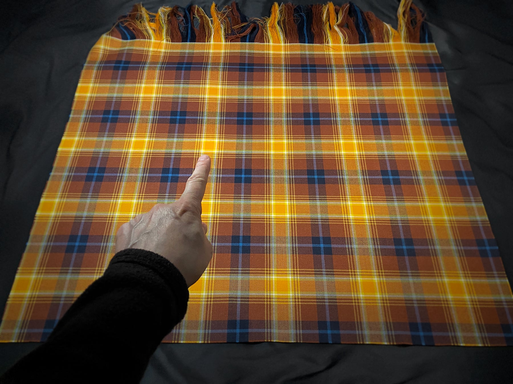 Photograph of the Angels’ Share tartan cloth showing the pivot location used for the published artwork.