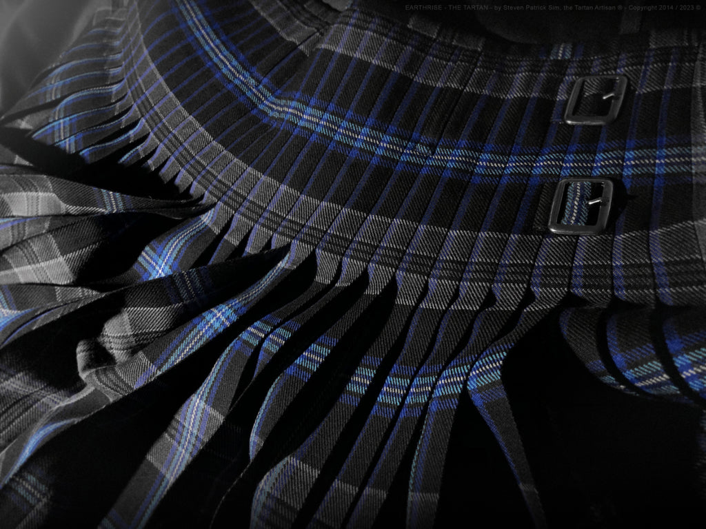 A detailed view of Earthrise tartan pleats with the photograph positioned to accentuate the illusion of planetary ascent.