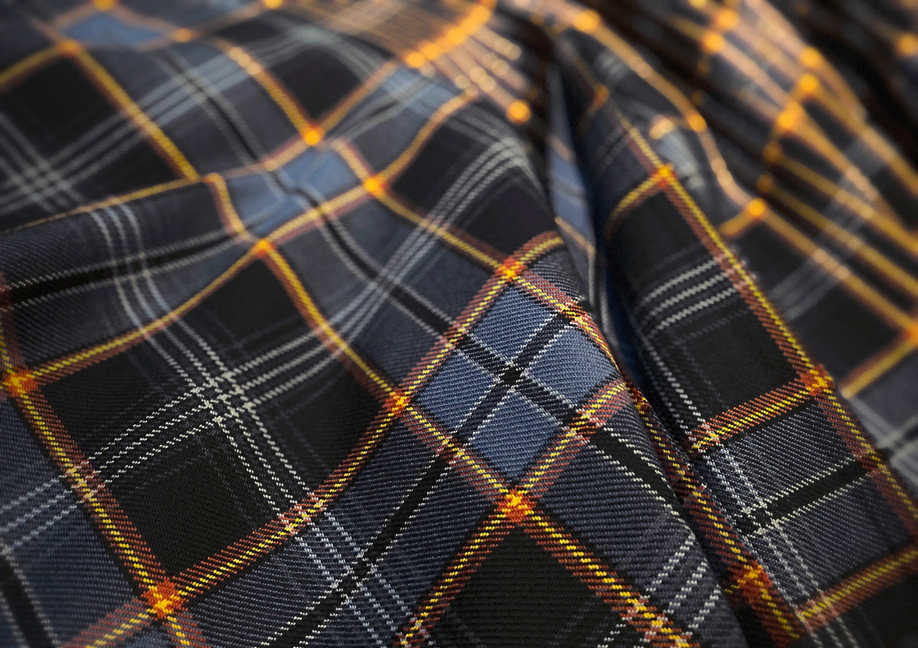 North Sea Oil heavyweight 16oz tartan kilt, expertly crafted by Steven Patrick Sim the Tartan Artisan, featuring bold, rich colors with pleats set to the stripe for a traditional, striking appearance.