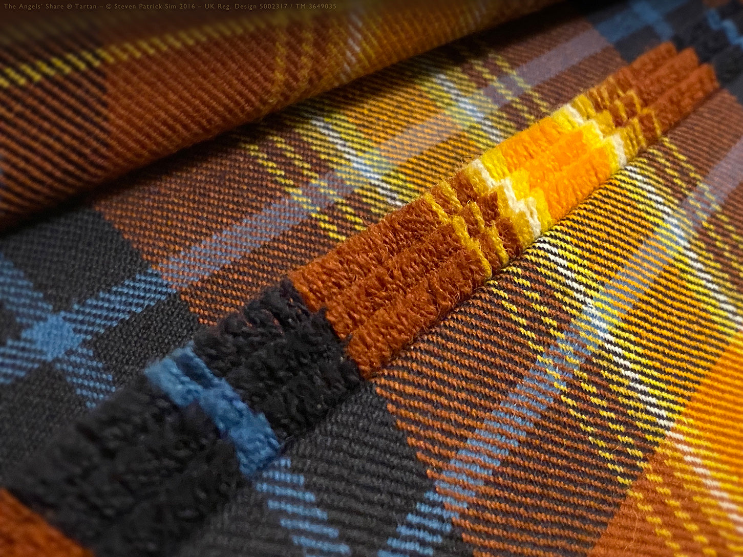 Tight macro of triple-fringed edge on the Angels’ Share kilt, highlighting vibrant orange, blue, and golden threadwork. Precision in fringe — handmade heritage in every thread.