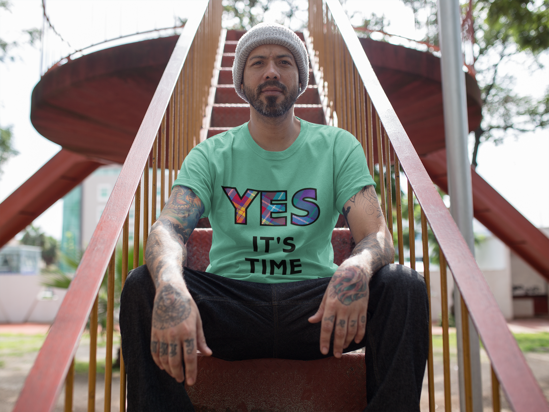 Man wearing the YES Tartan green t-shirt