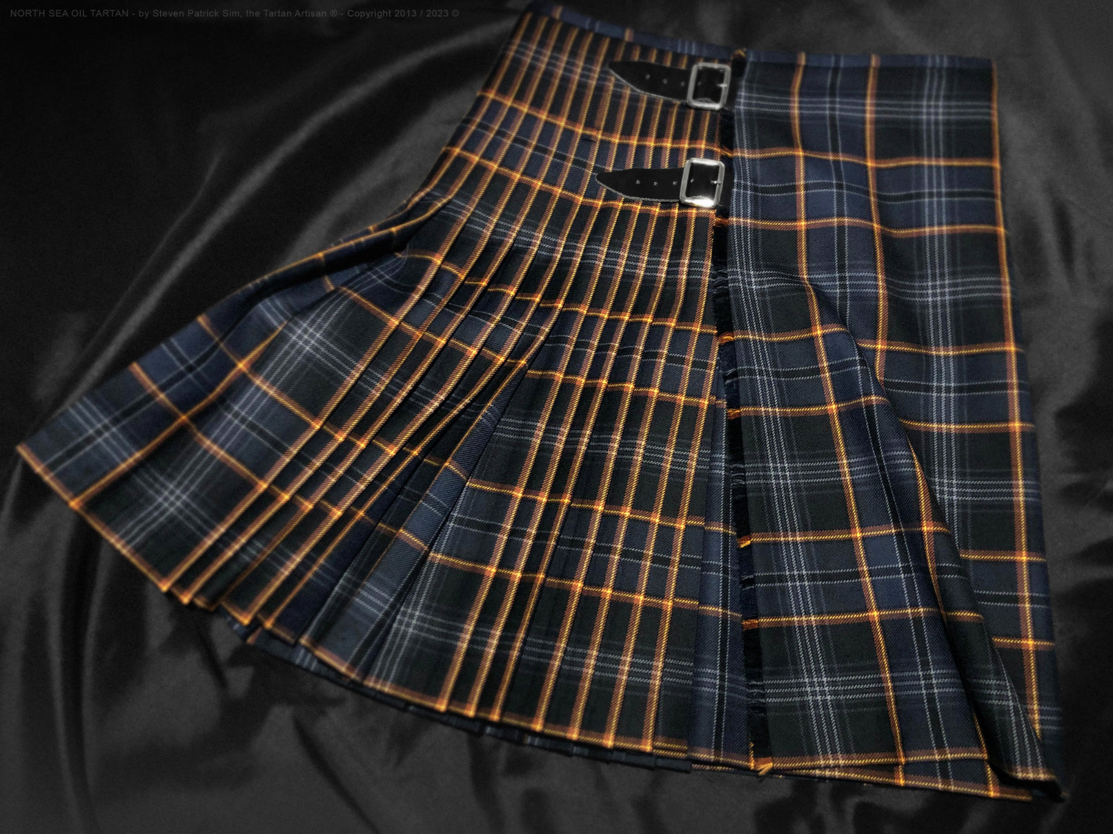 North Sea Oil classic tartan kilt, pleated to the stripe and finished on the flame, expertly tailored by Steven Patrick Sim the Tartan Artisan, showcasing vibrant colors and precise traditional detailing.
