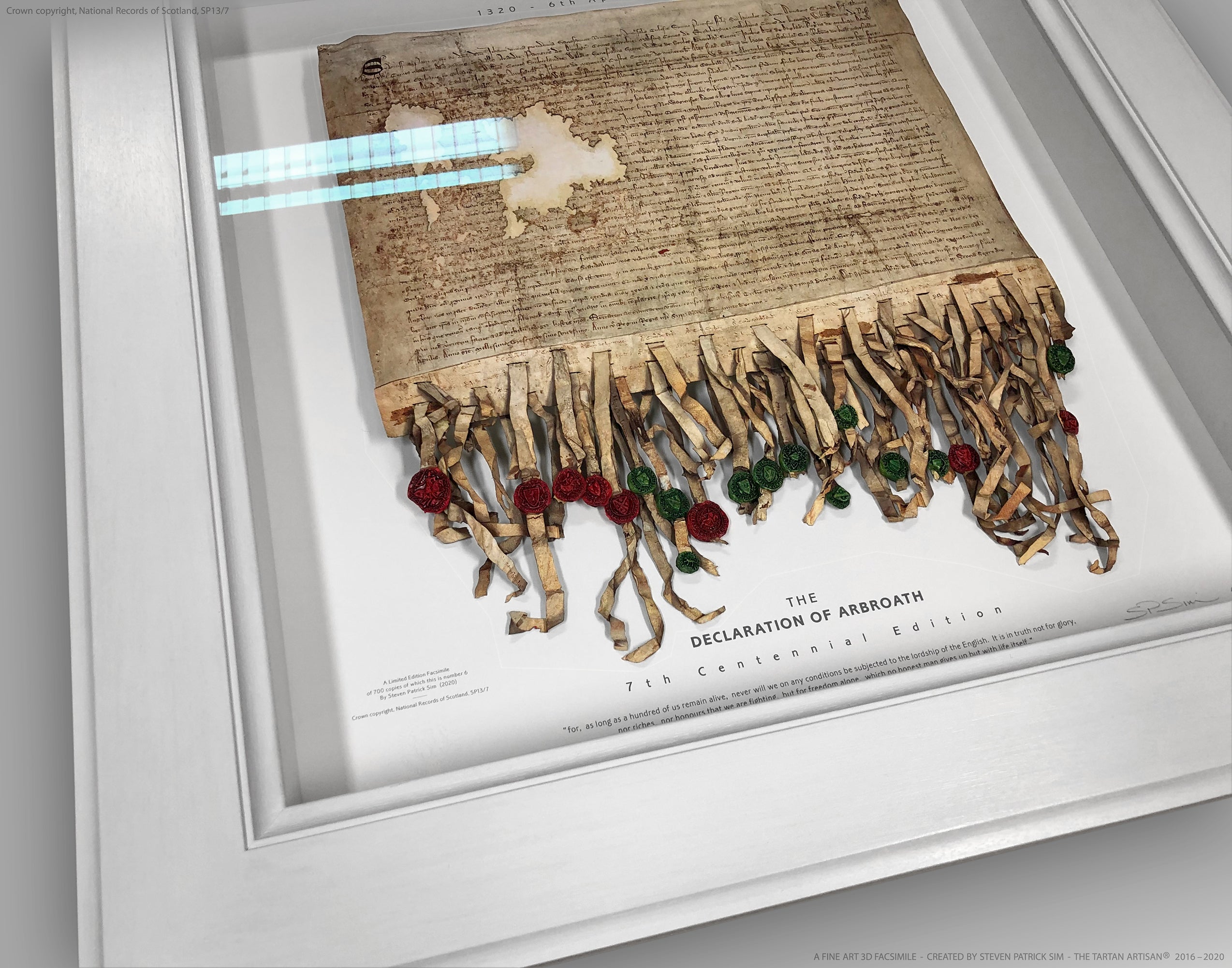 Overhead view of the complete white-framed Declaration of Arbroath Fine-Art 3D Facsimile, showing the parchment body, seal ribbons and surrounding white frame.