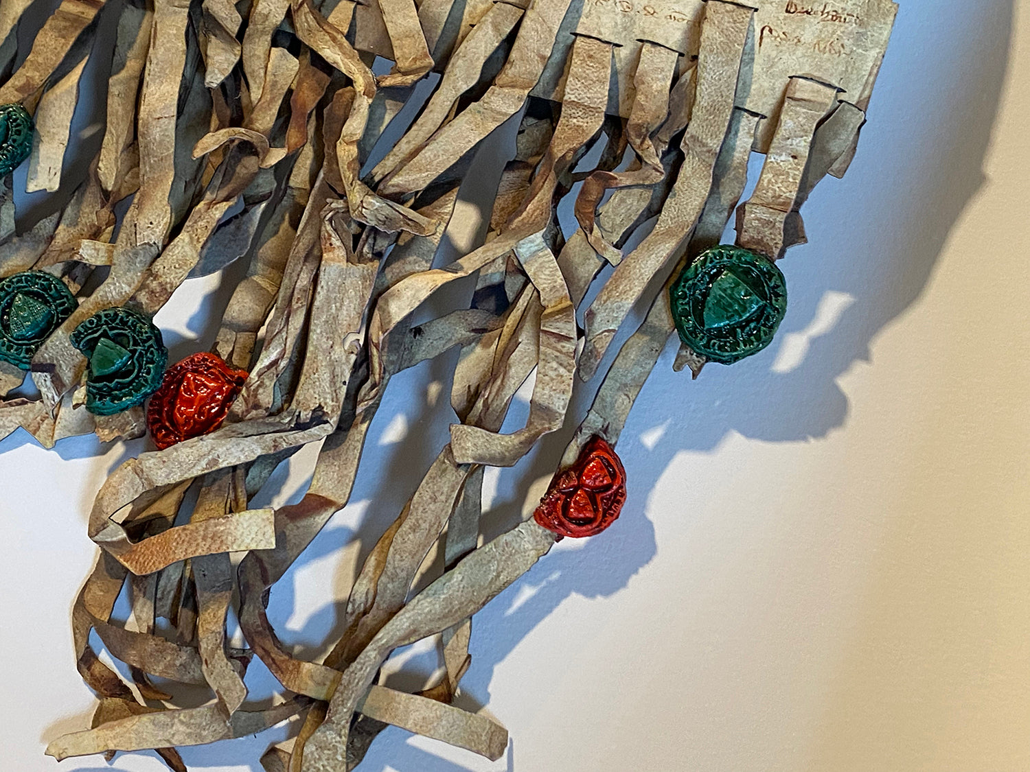 Cluster of hanging seal tags with red and green cast seals on the Declaration of Arbroath Fine-Art 3D Facsimile.