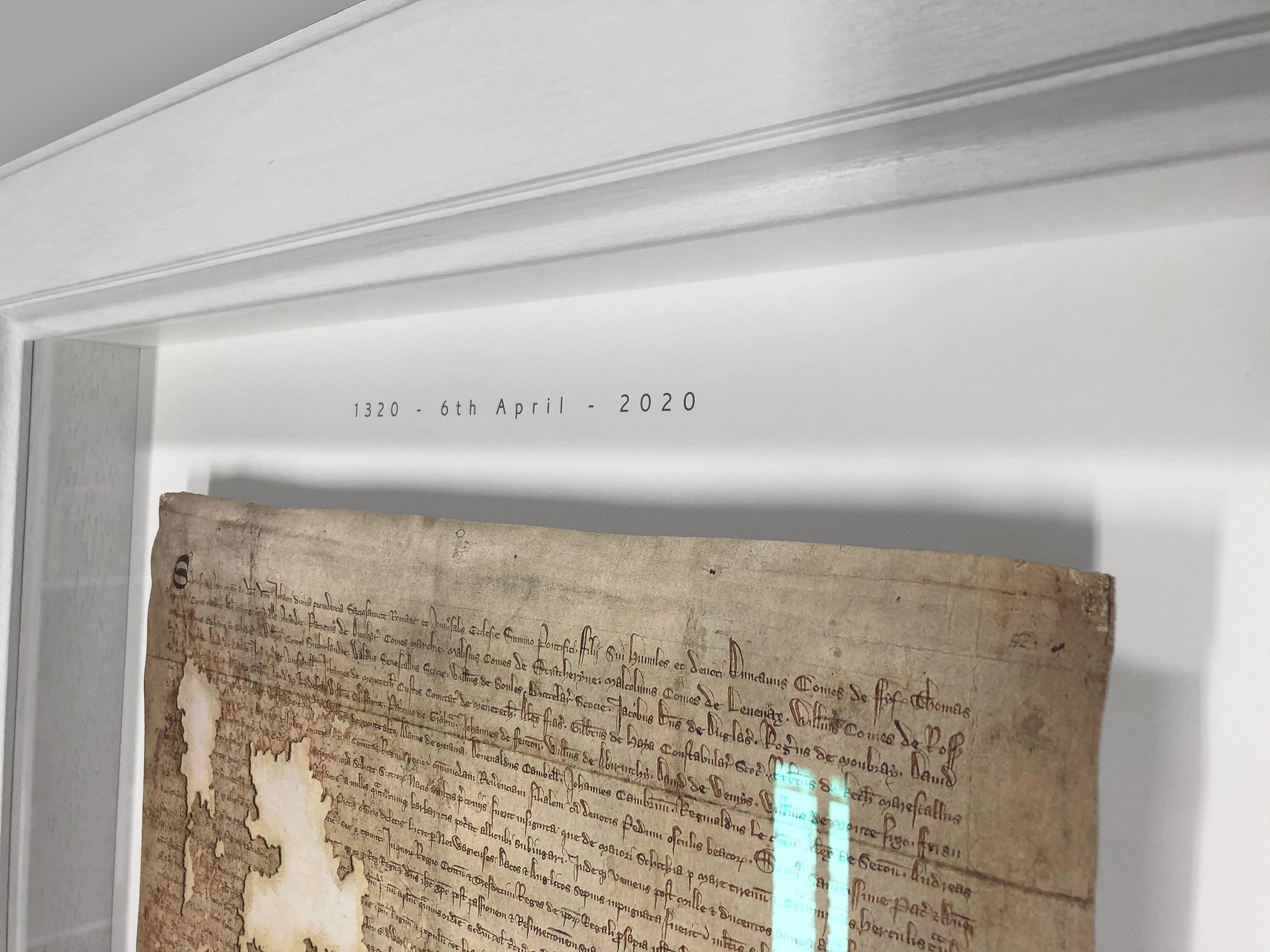 Upper manuscript view inside the white frame of the Declaration of Arbroath Fine-Art 3D Facsimile, showing the aged document surface and frame depth.