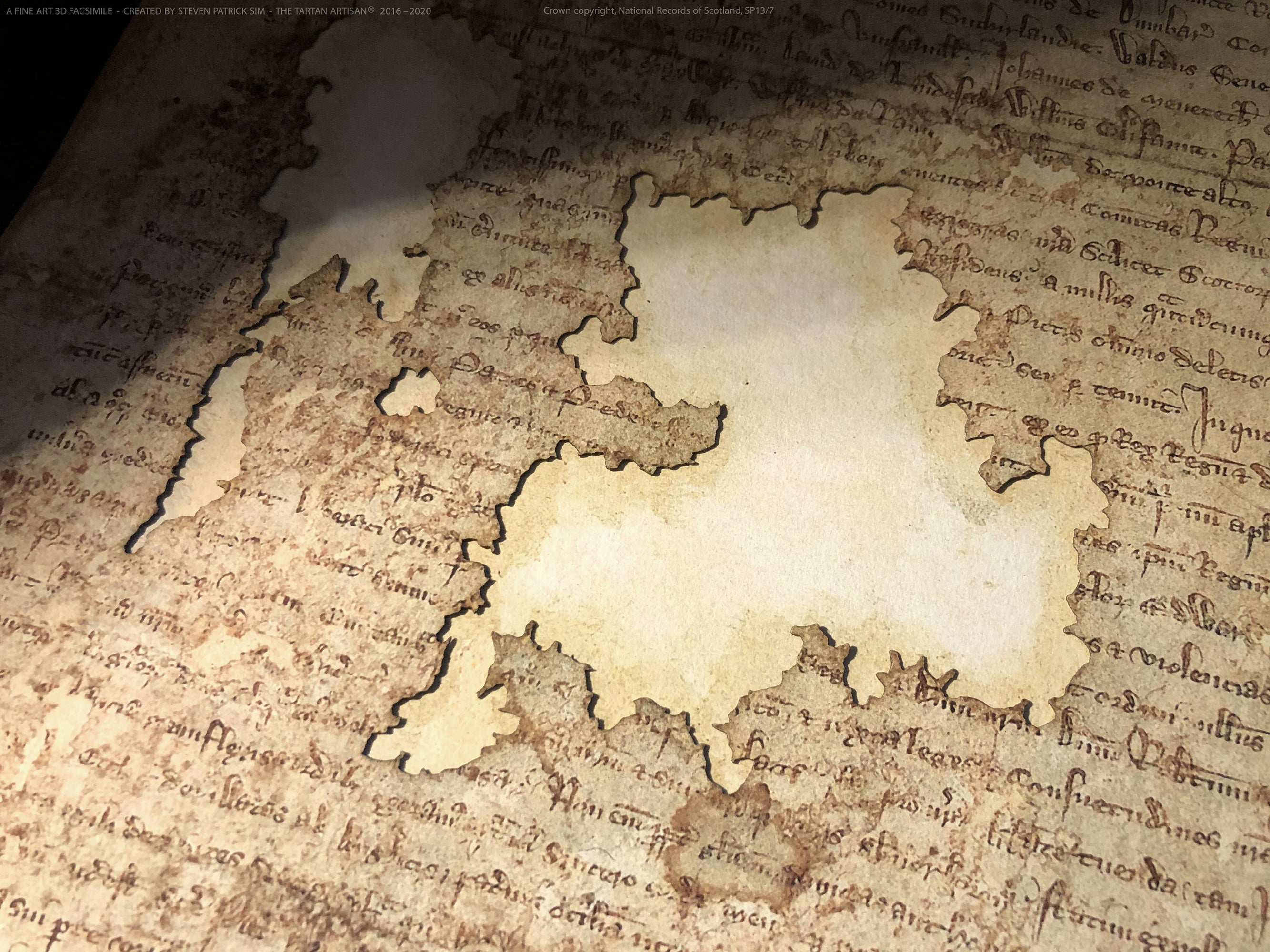 Close detail of the damaged parchment area on the Declaration of Arbroath Fine-Art 3D Facsimile, showing aged texture and document-loss character.