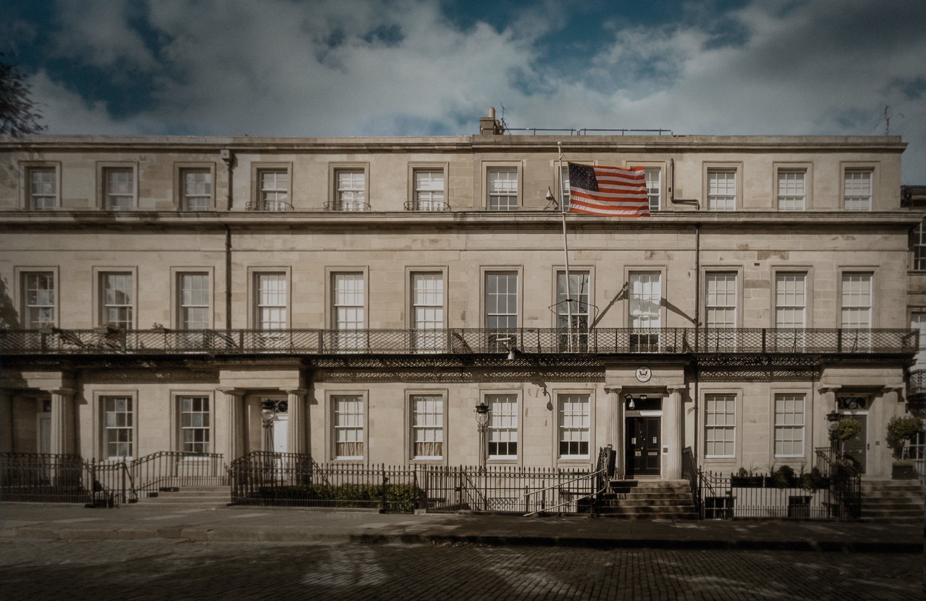 The façade of the U.S. Consulate General on Regent Terrace, Edinburgh, with the American flag displayed proudly above the Georgian-style portico.