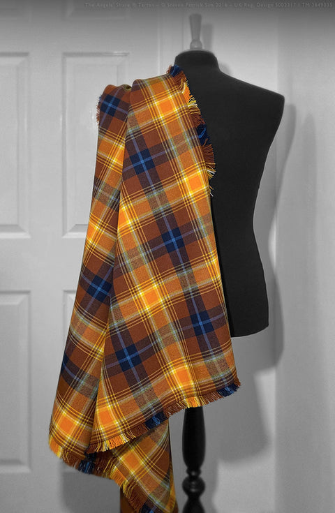 Full-length view of the Angels’ Share Scotch Whisky tartan fringed fly plaid draped over a dress form, displaying the complete sett, scale, and flowing fringe.