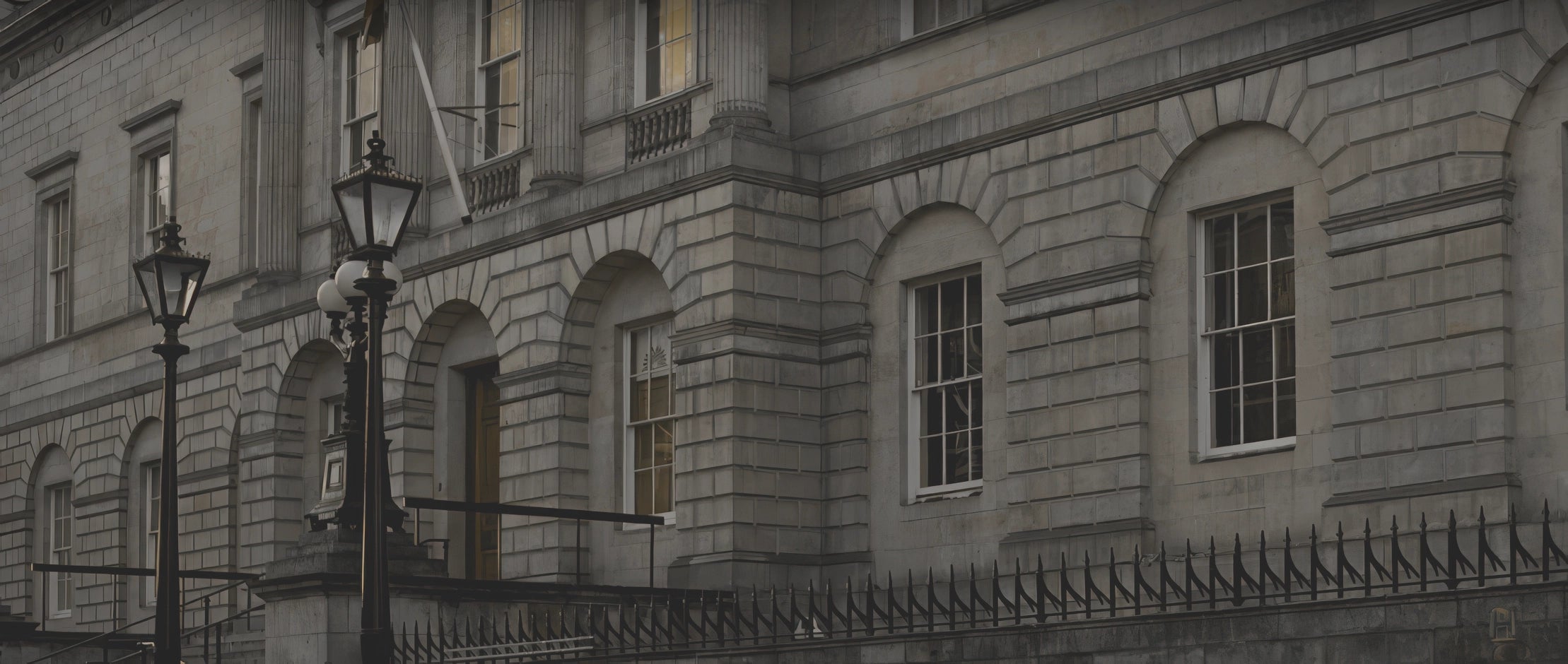 Exterior of the Scottish Register of Tartans building in Edinburgh with classic stone architecture and iron railings. 
