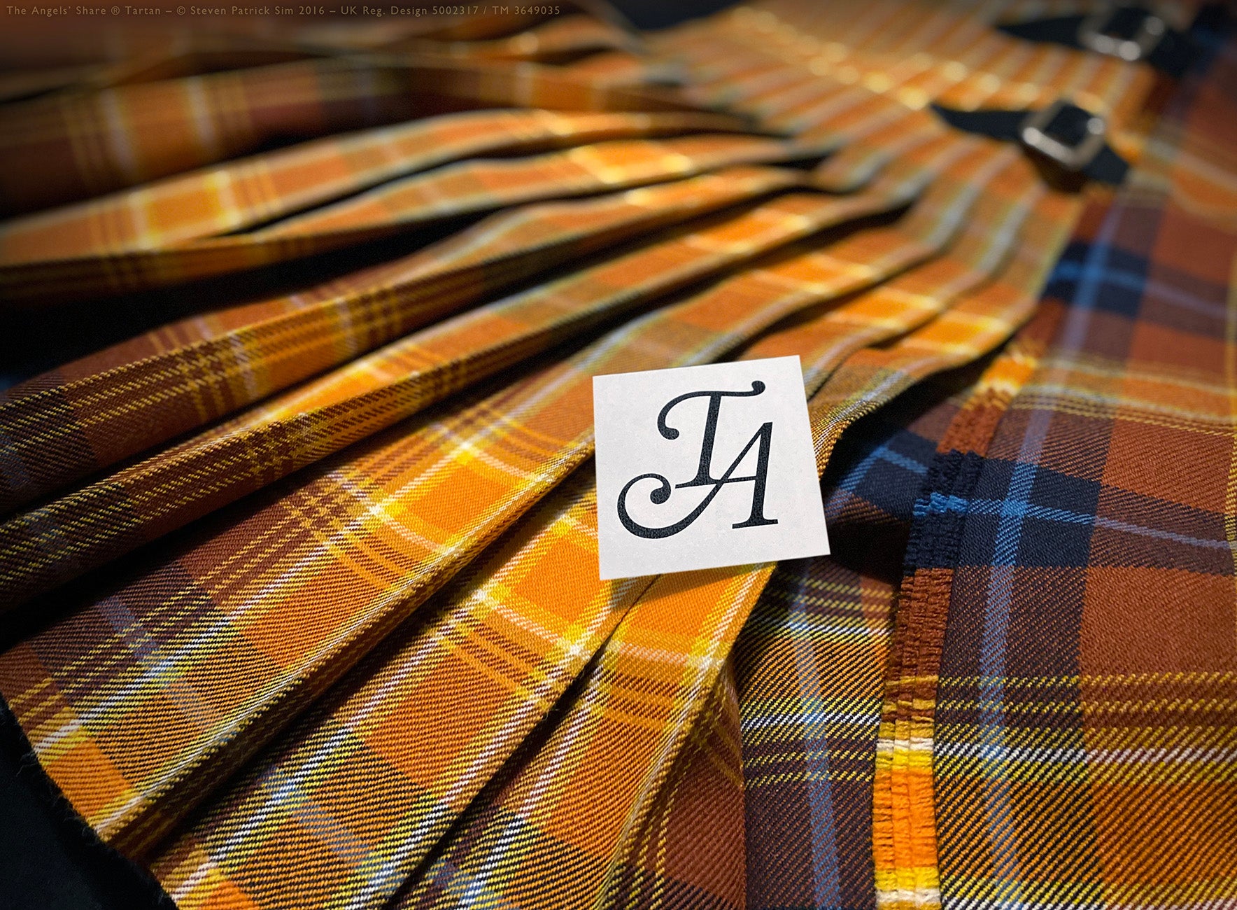 Full-length 8-yard Angels’ Share® kilt laid flat, pleated to the Angelic military stripe in glowing ethereal lines using 16oz heavyweight tartan woven by Lochcarron. Bold pleat-to-stripe — illuminated and anchored in tradition. By Steven Patrick Sim, the Tartan Artisan.