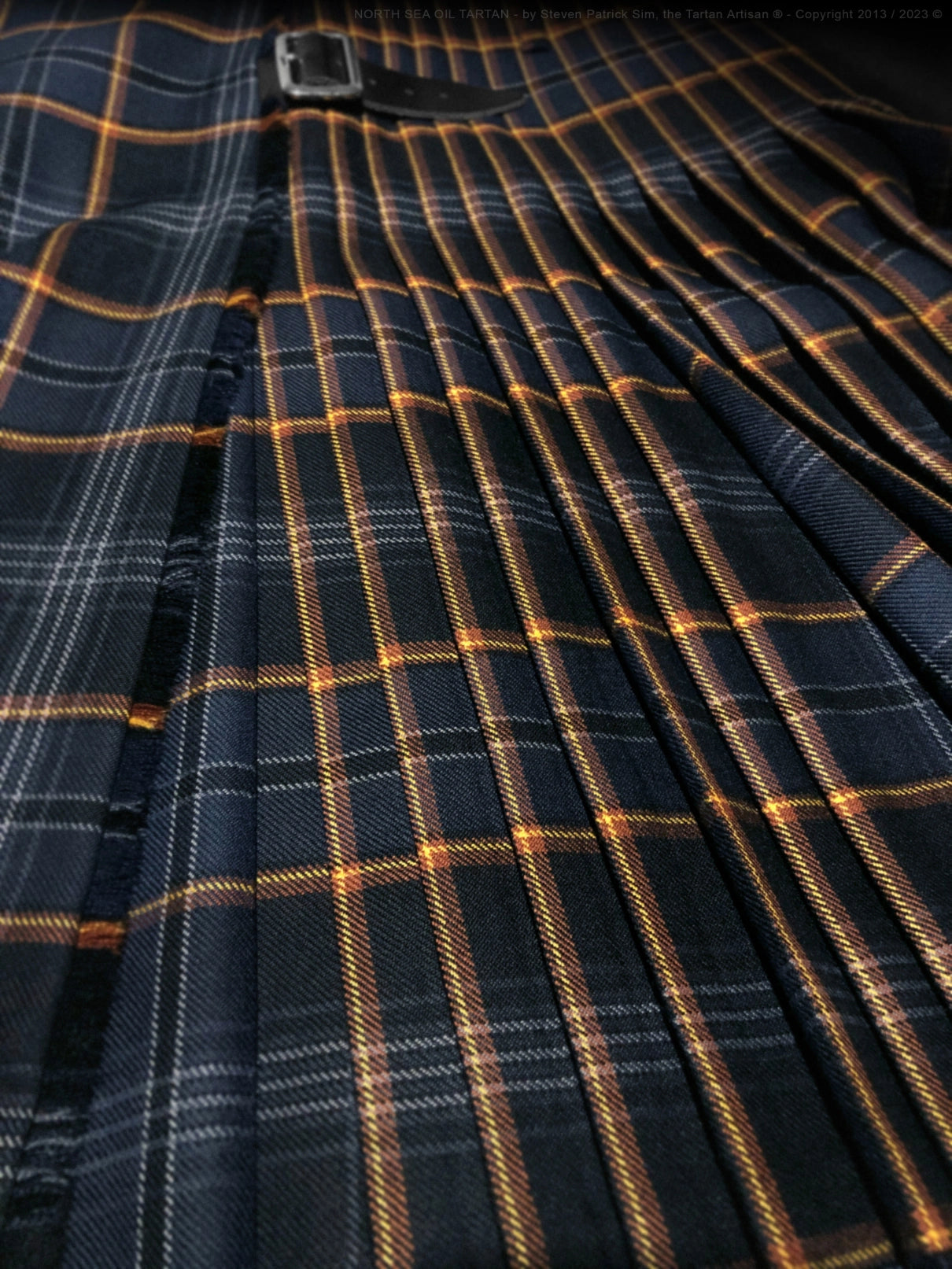Side view of the North Sea Oil tartan kilt highlighting pleats, stitching lines, and structural detailing that ensure durability and precise drape.