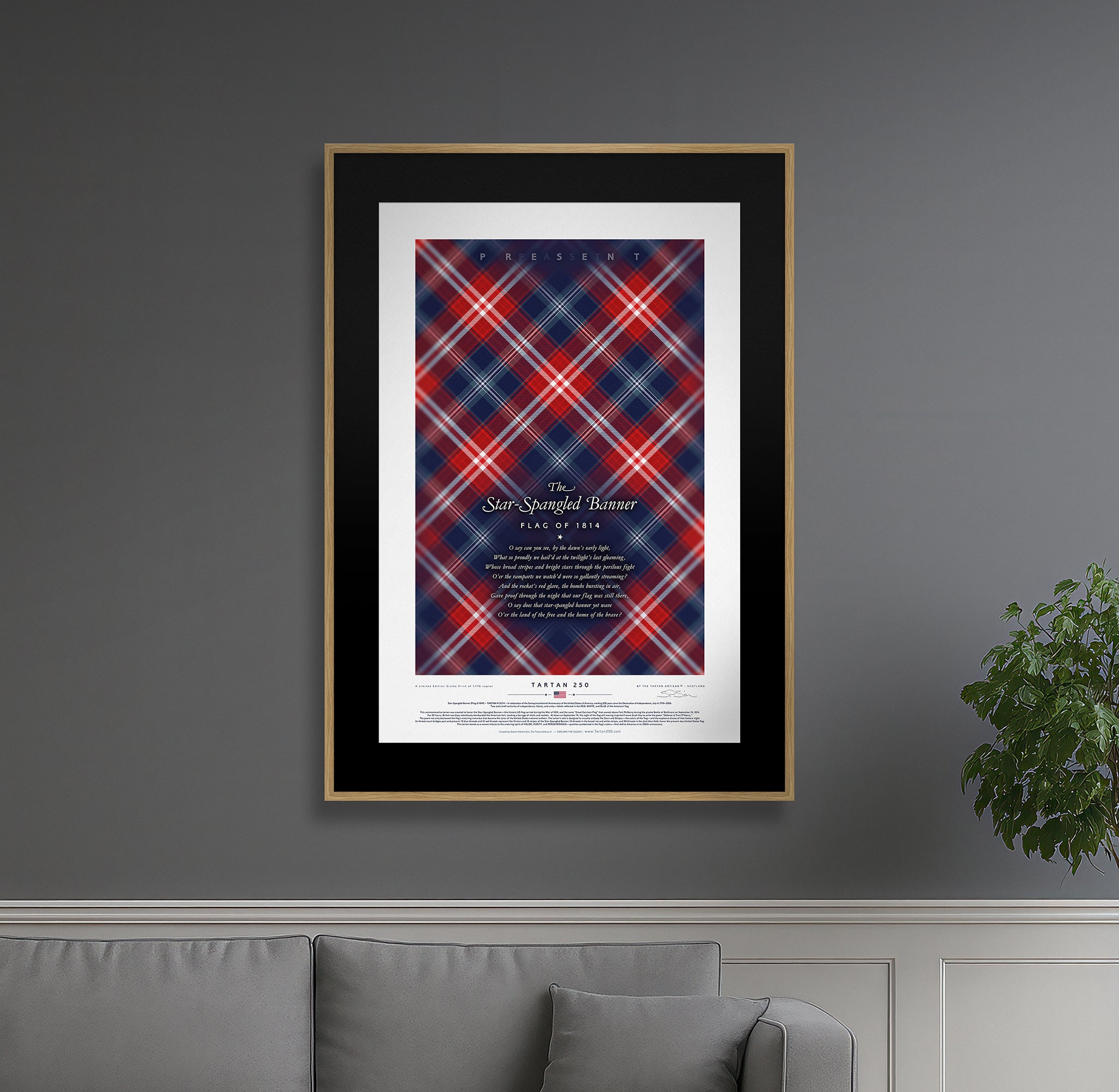 Star-Spangled Banner America250 framed collector’s edition – Tartan250 print in oak frame, lifestyle wall view with couch and plant.