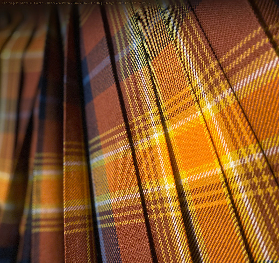 The Tartan Artisan®’s signature Angels’ Share® Scotch Whisky Kilt in pleat-to-sett — a celebration of craft and vision. Where Highland dress meets whisky tradition — by The Tartan Artisan®.