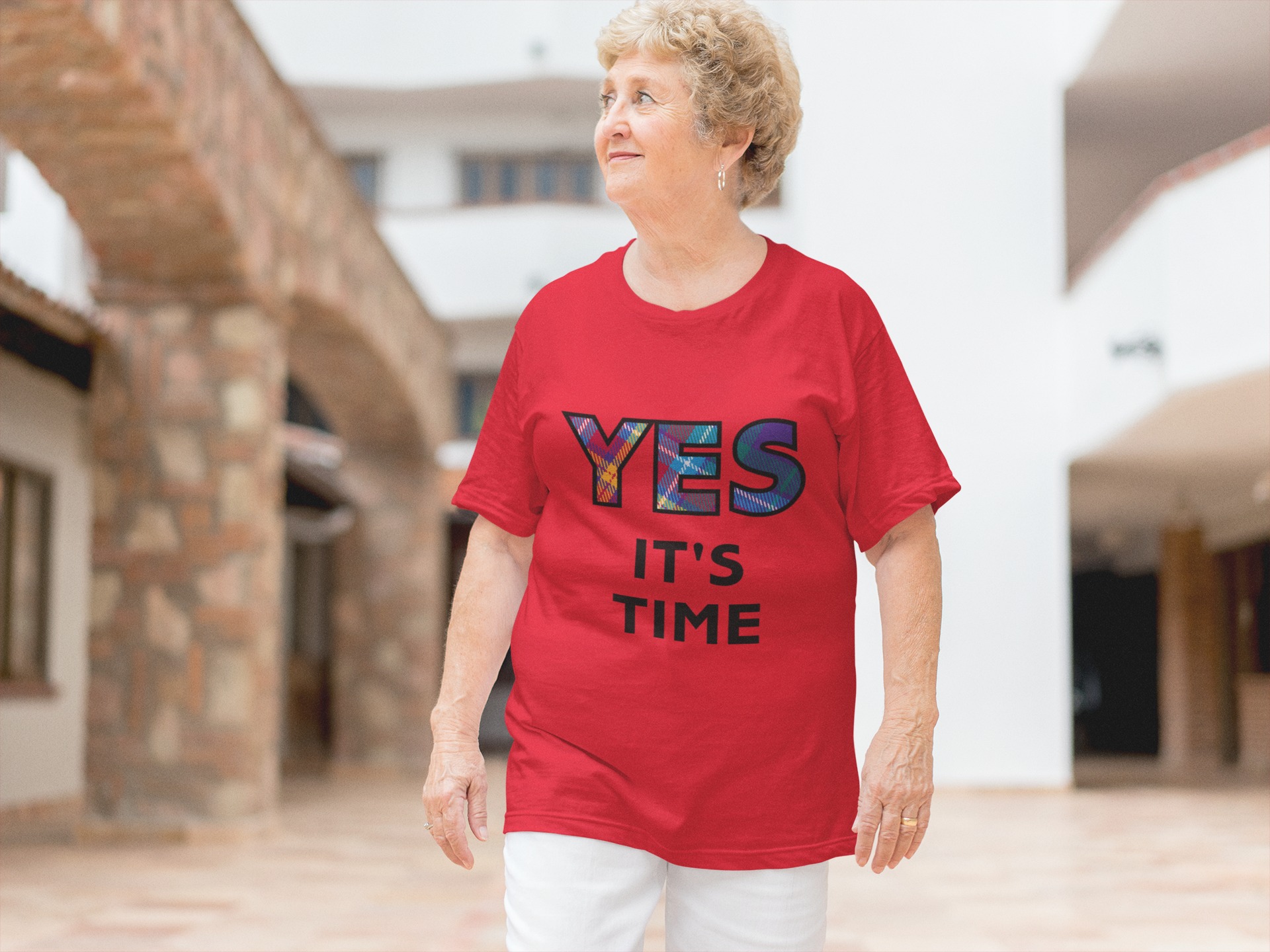 Senior Lady wearing the YES Tartan red t-shirt